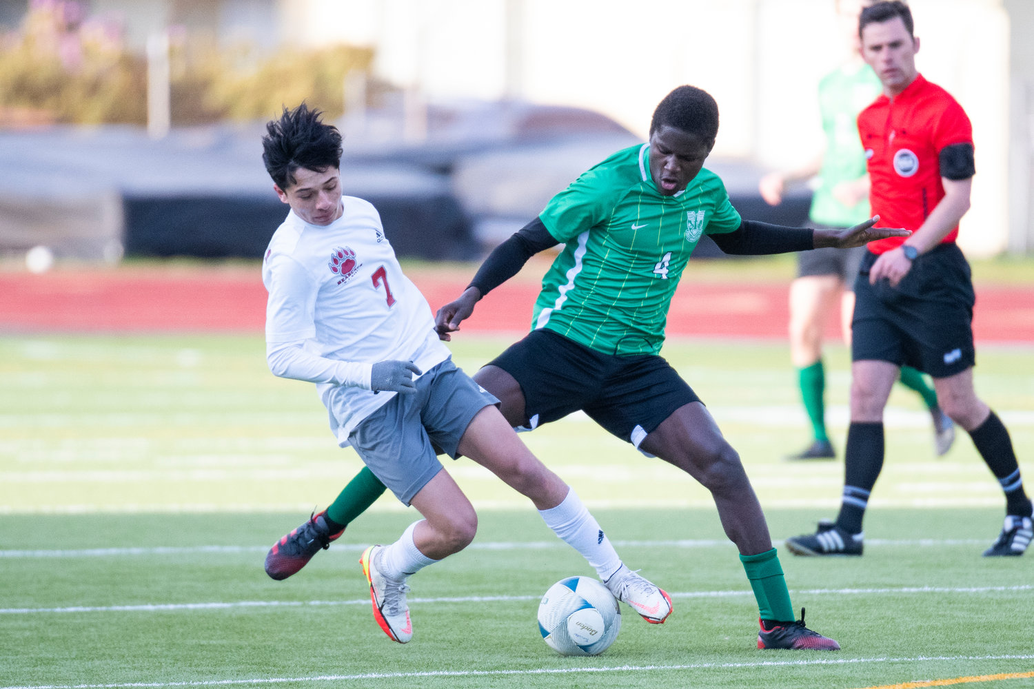 W.F. West's Damian Hernandez (7) and Tumwater's Sambou Jamada (4) battle for possession during the district semfinals on May 12.
