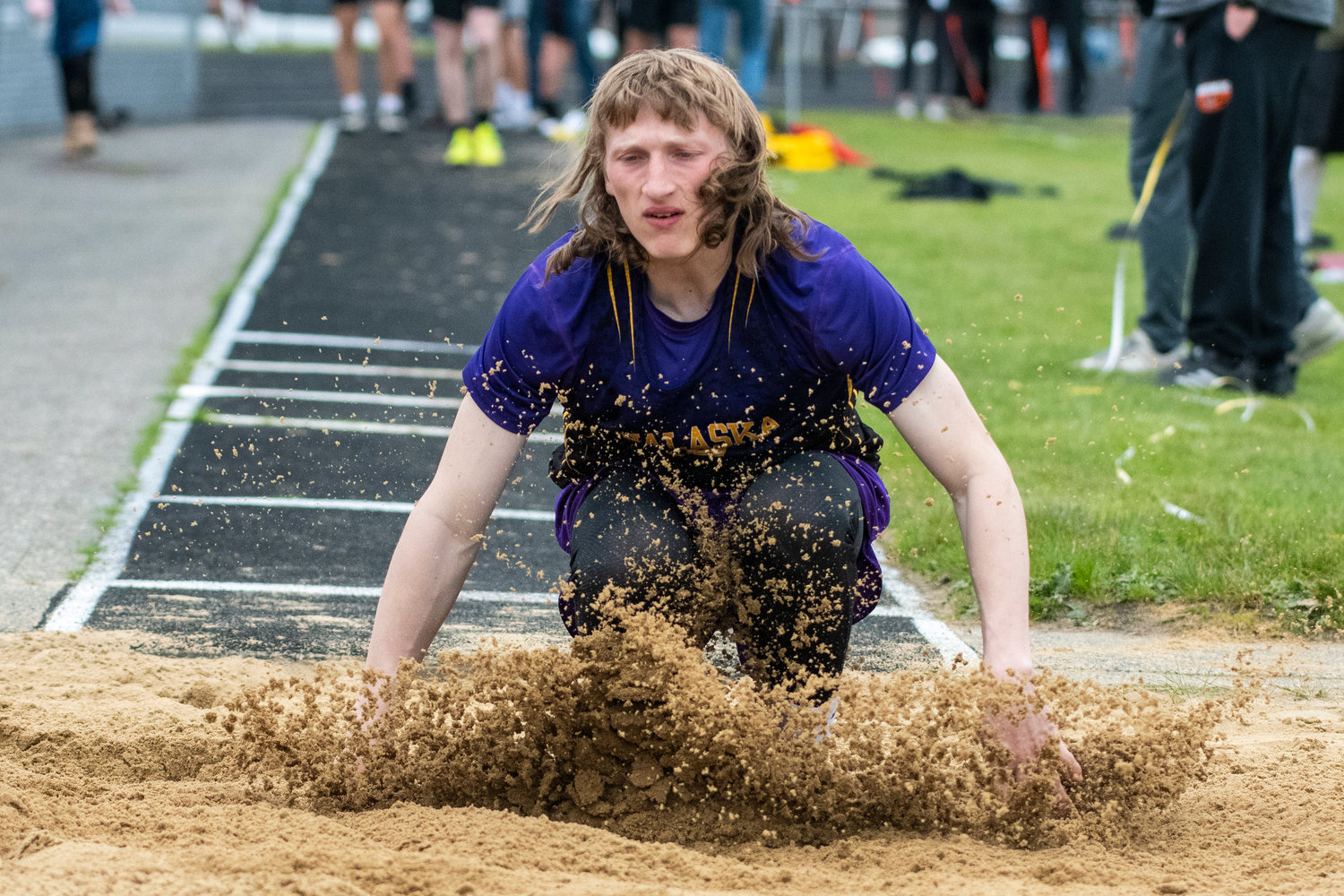 Onalaska's Kole Taylor hits the triple jump pit during the Central 2B League Championships on May 13.