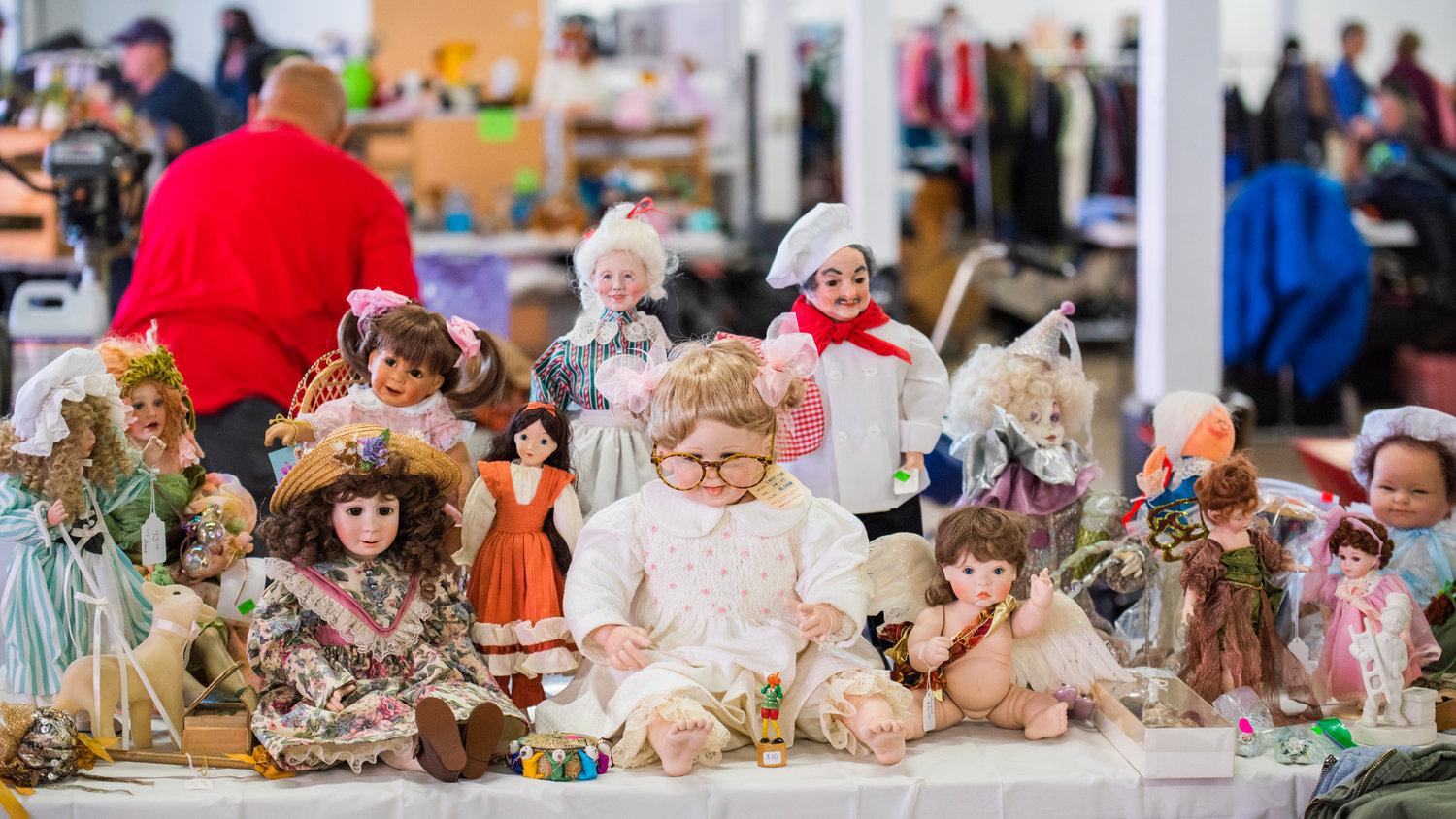 Vintage dolls sit on display during the Spring Community Garage Sale at the Southwest Washington Fairgrounds Saturday morning in Centralia.