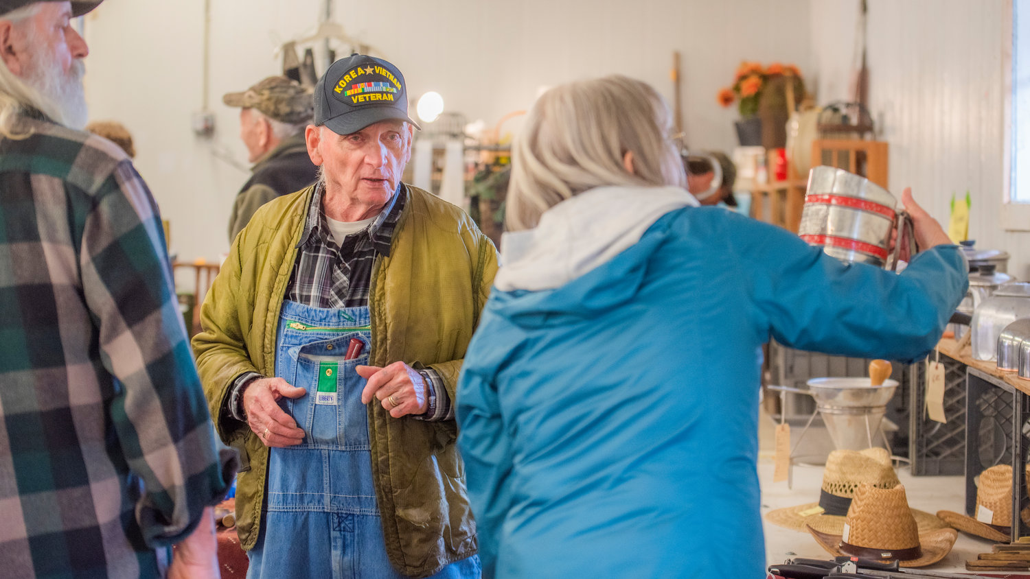 Burt Illig, 88, helps a customer during the Spring Community Garage Sale Saturday morning in Centralia. Illig is the oldest vendor at the sale and has eight grandchildren, 22 great grandchildren and one great-great grandson.