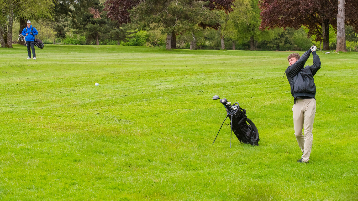 Adna’s Chase Collins swings his club as the ball flies Wednesday in Chehalis at Riverside Golf Course.