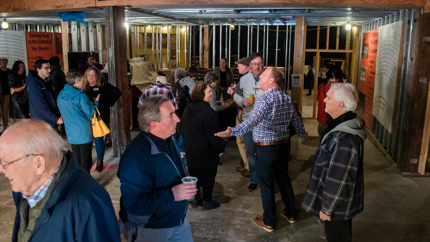 Scott White mingles with attendees of a Centralia-Chehalis Chamber of Commerce Business After Hours event and open house at the Fox Theater Thursday in Centralia.