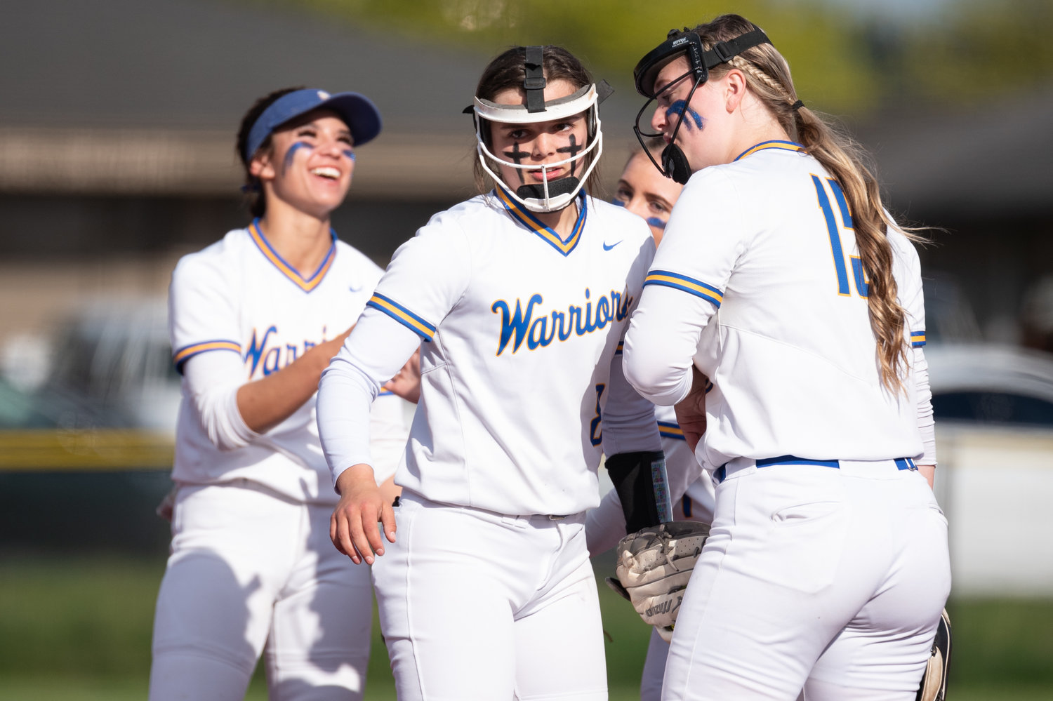 Rochester pitcher Layna Demers (center) celebrates with teammates after an out against Aberdeen in the 2A District 4 playoffs May 20 at Rec Park.