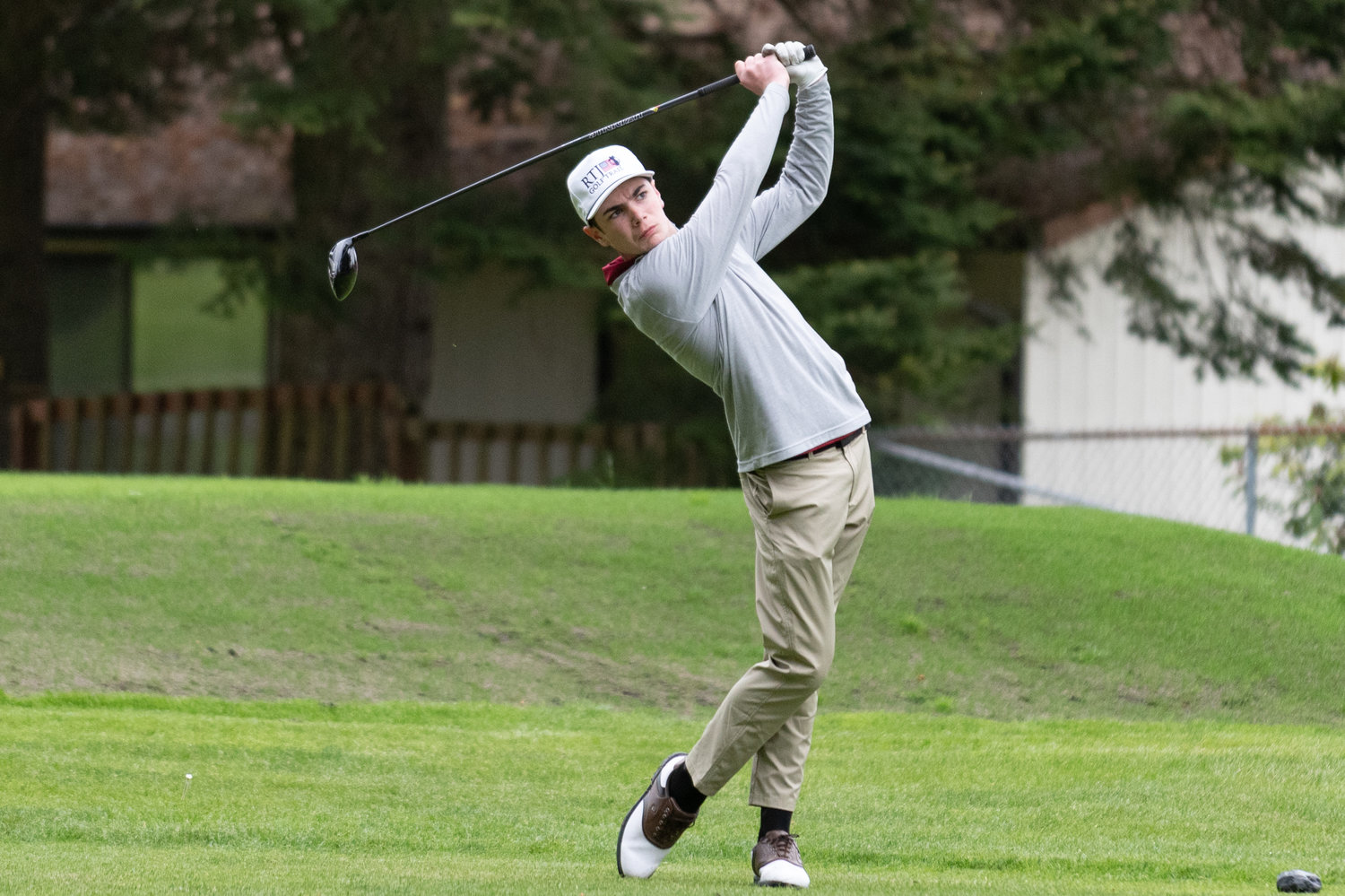 W.F. West golfer Ben Halverstadt watches his ball after a shot on the first hole at Capital City Golf Course in Olympia at the 2A State Boys Golf Championships May 24.