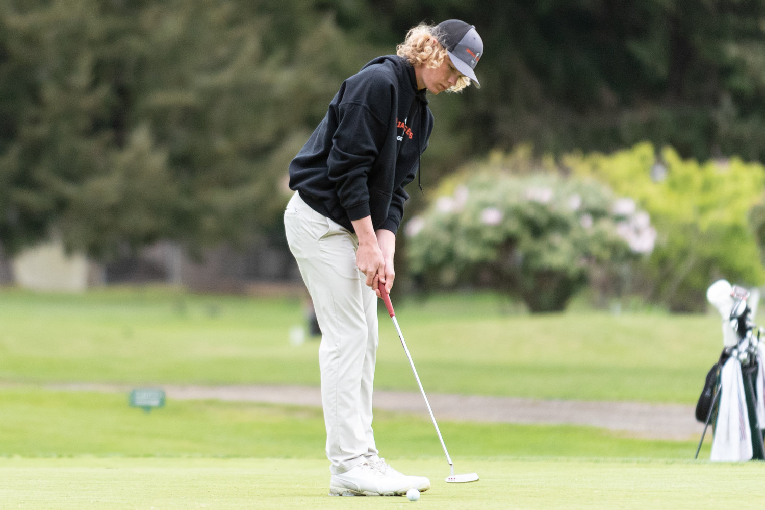 Centralia golfer Von Wasson hits a short put at Capital City Golf Course in Olympia at the 2A State Boys Golf Championships May 24.