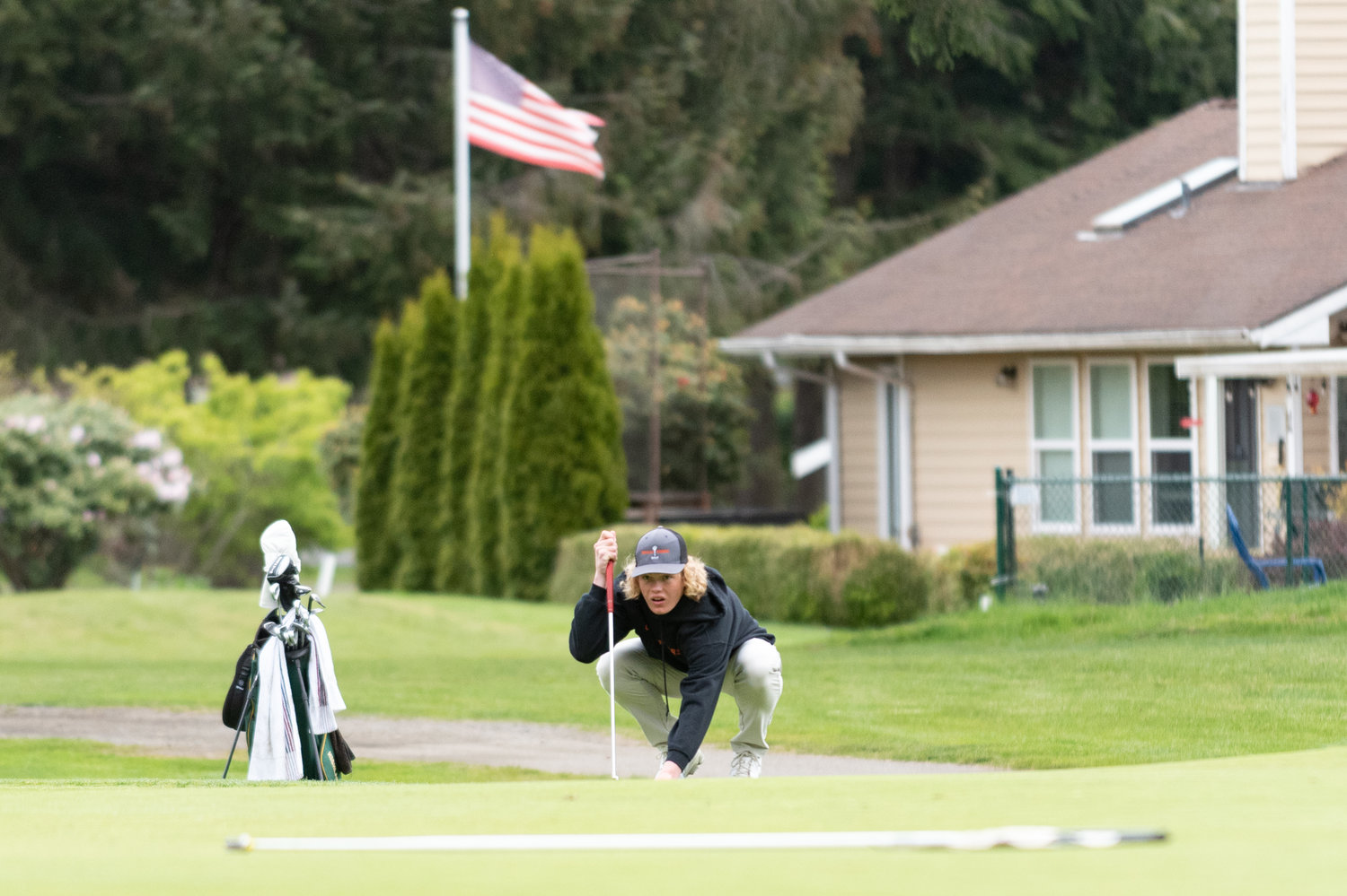 Centralia golfer Von Wasson eyes the first hole before a shot attempt at Capital City Golf Course in Olympia at the 2A State Boys Golf Championships May 24.