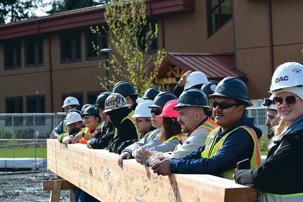 Construction workers pose for a photo prior to the ceremony at the Nisqually Tribe’s Elder Center on May 19.