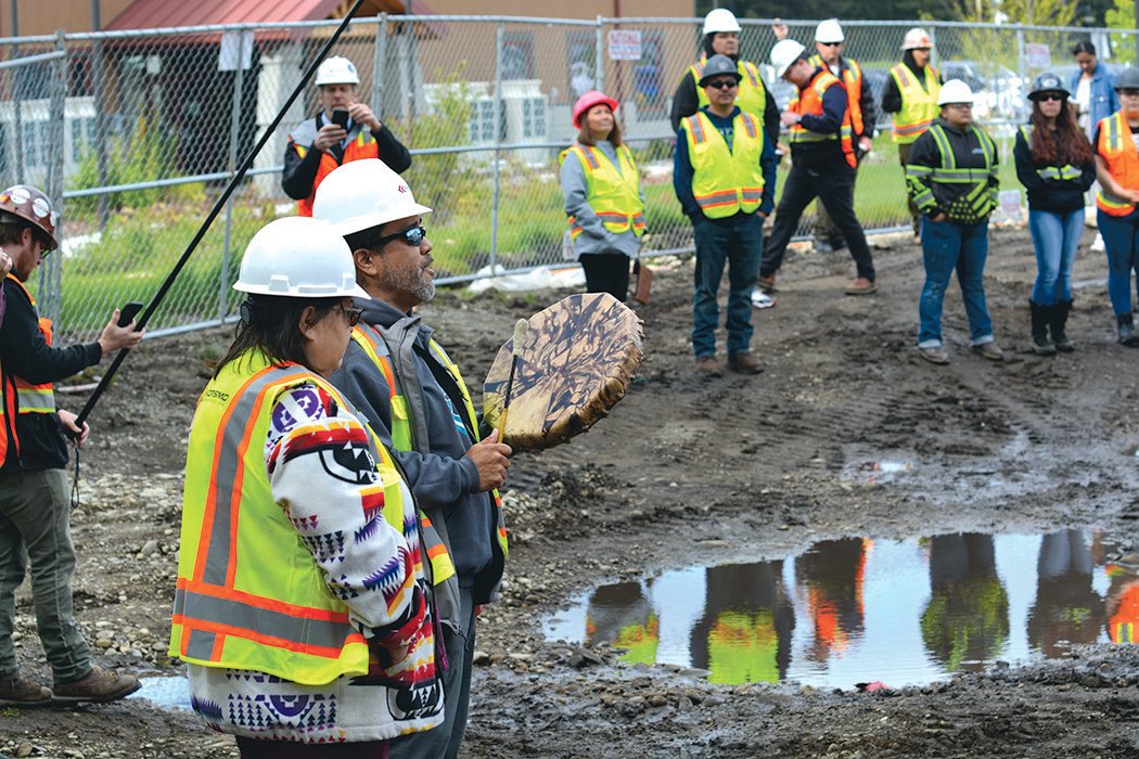 Nisqually Tribe elders Cleo Frank and Hanford McCloud sing a ceremonial song on May 19 at the tribe’s under construction Elder Center.