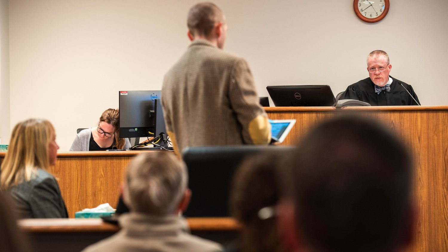 Judge Wade Samuelson talks to Laurel Khan, owner of Mackinaw's Restaurant and connected bar, Curious, in Chehalis, and her defense attorney in District Court Tuesday morning at the Lewis County Law and Justice Center.