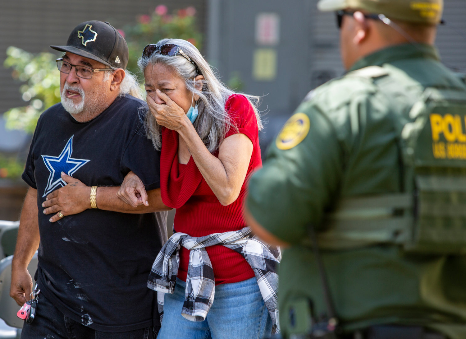 A woman cries Tuesday, May 24, 2022, as she leaves the Uvalde Civic Center, in Uvalde, Texas. At least 14 students and one teacher were killed when a gunman opened fire at Robb Elementary School in Uvalde, according to Texas Gov. Gregg Abbott. (William Luther/San Antonio Express-News/Zuma Press/TNS)