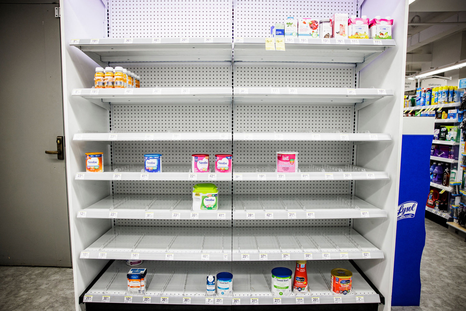 Shelves normally meant for baby formula sit nearly empty at a store in downtown Washington, D.C., on May 22, 2022. (Samuel Corum/AFP/Getty Images/TNS)