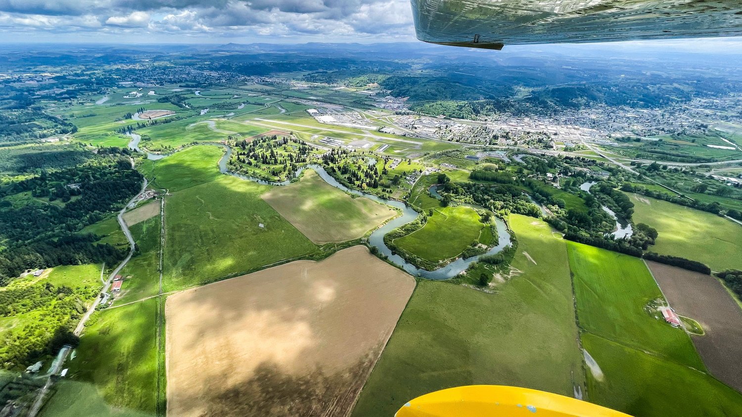 The Chehalis River winds alongside the Twin Cities seen from above on a Friday flight.