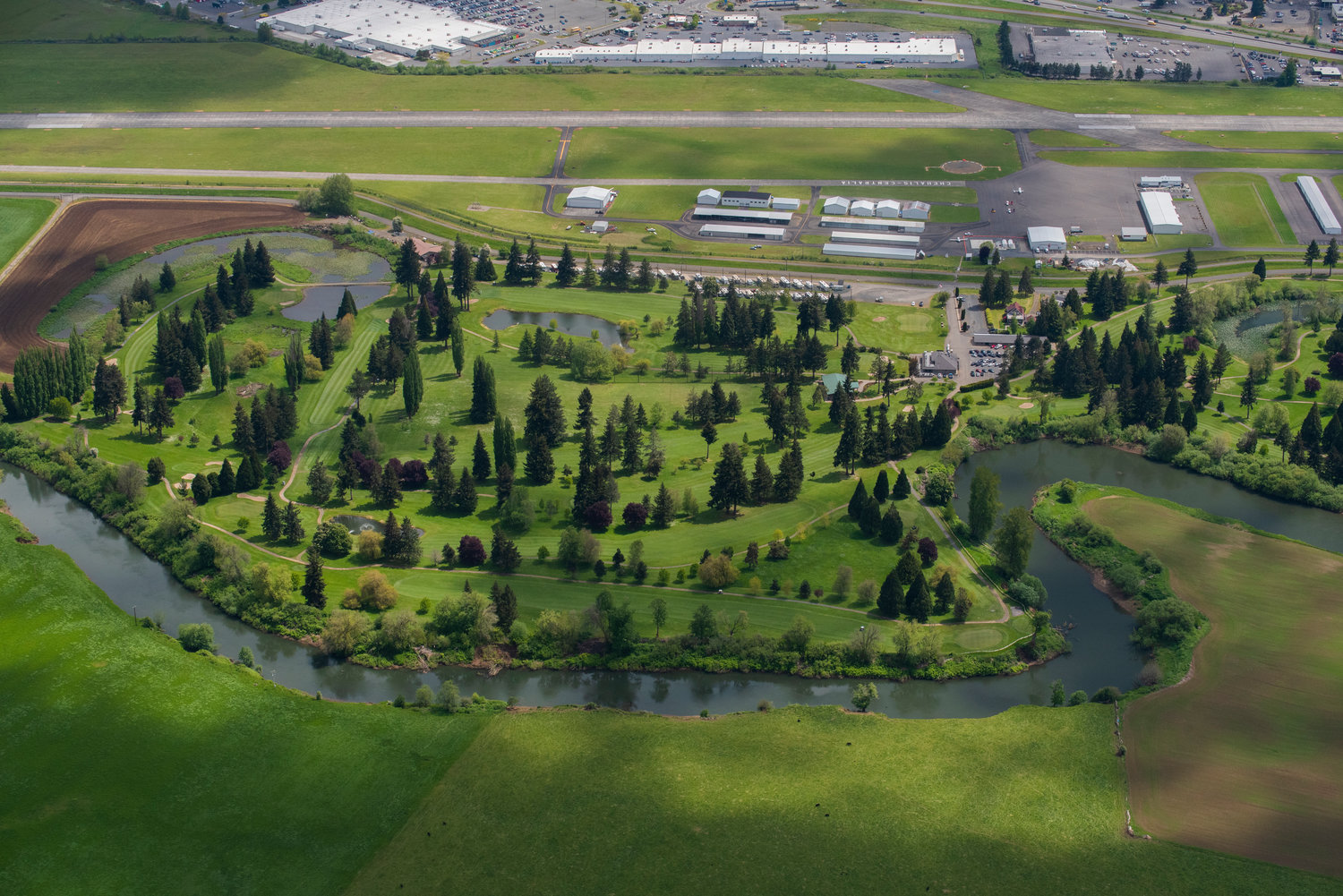 The Chehalis River winds alongside Riverside Golf Course and the Chehalis-Centralia Airport on Friday.