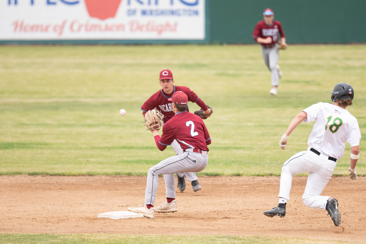 W.F. West shortstop Brock Bunker and second baseman Braden Jones (2) connect on an out while Tumwater's Jack Worgorm tries to slide into second in the 2A State Baseball Semifinals at Yakima County Stadium May 27.