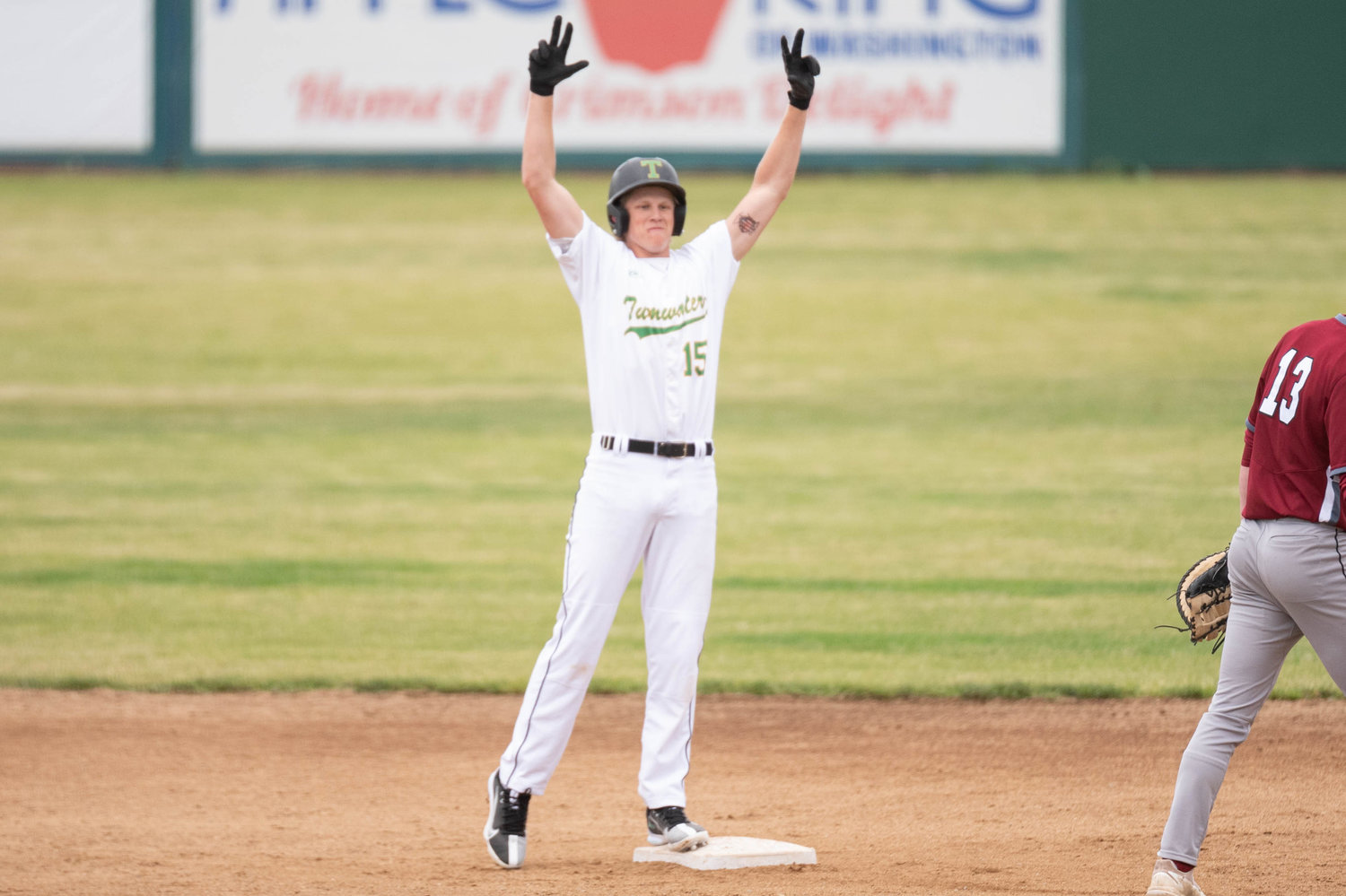 Tumwater's Alex Overbay celebrates after a double against W.F. West in the 2A State Baseball Semifinals at Yakima County Stadium May 27.