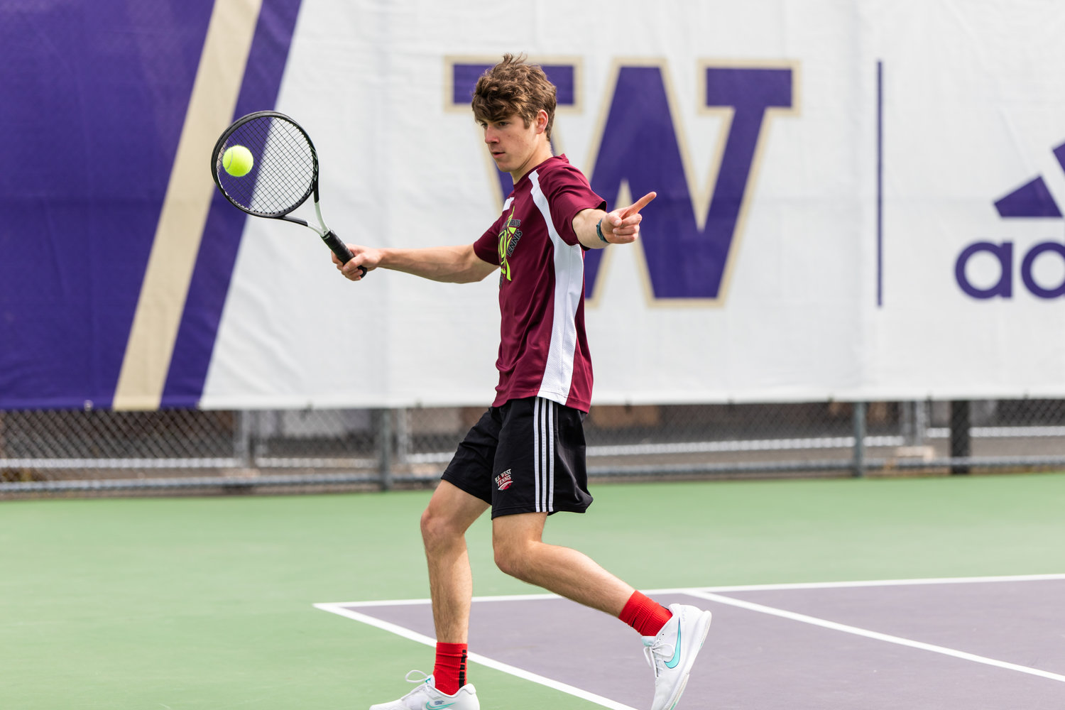 W.F. West's Aaron Boggess calls the ball out during the first set of the 2A boys' doubles tennis state competition on May 27, 2022.