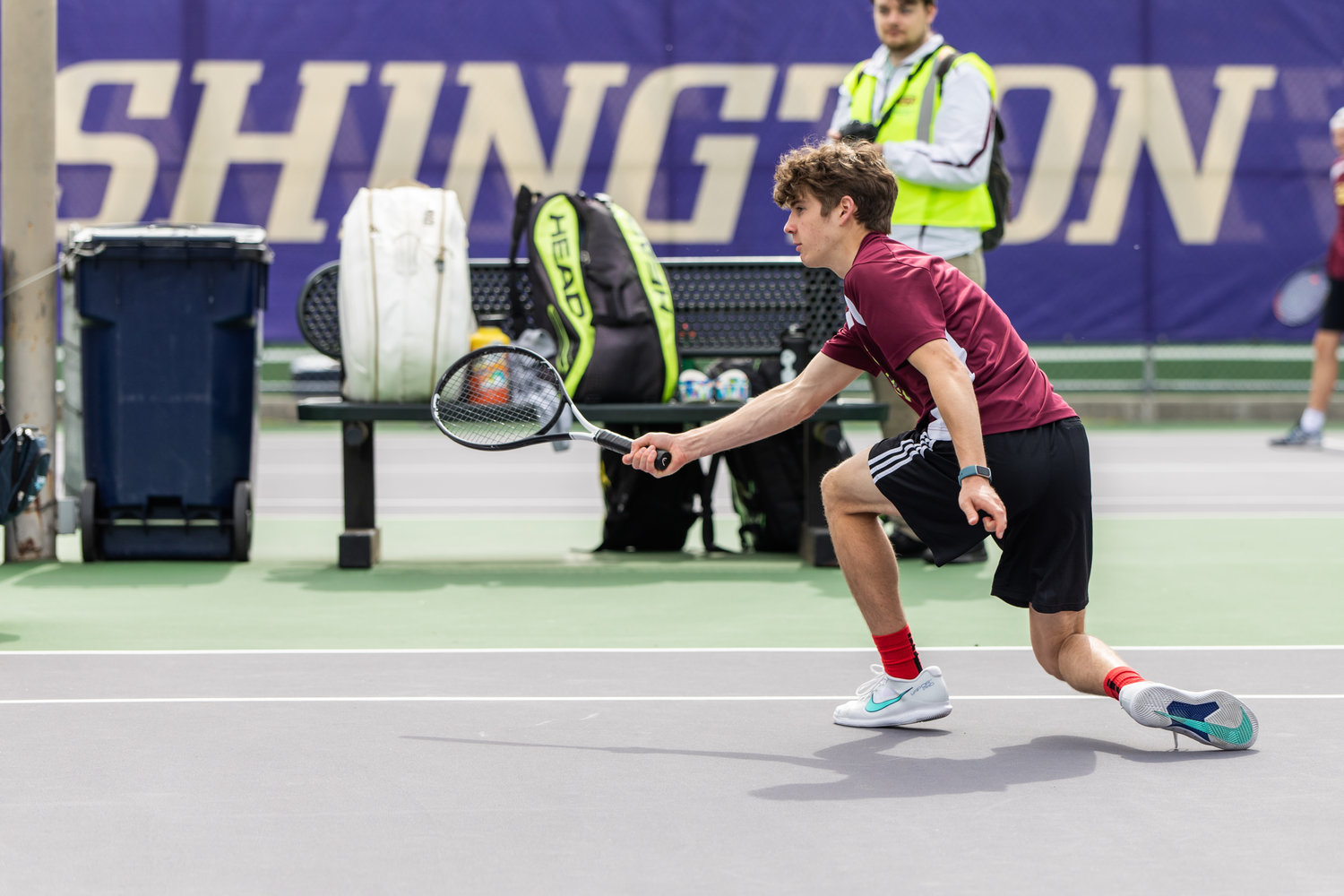 W.F. West's Aaron Boggess stretches forward to make contact with the ball during the first set of the 2A boys' doubles tennis state competition on May 27, 2022.