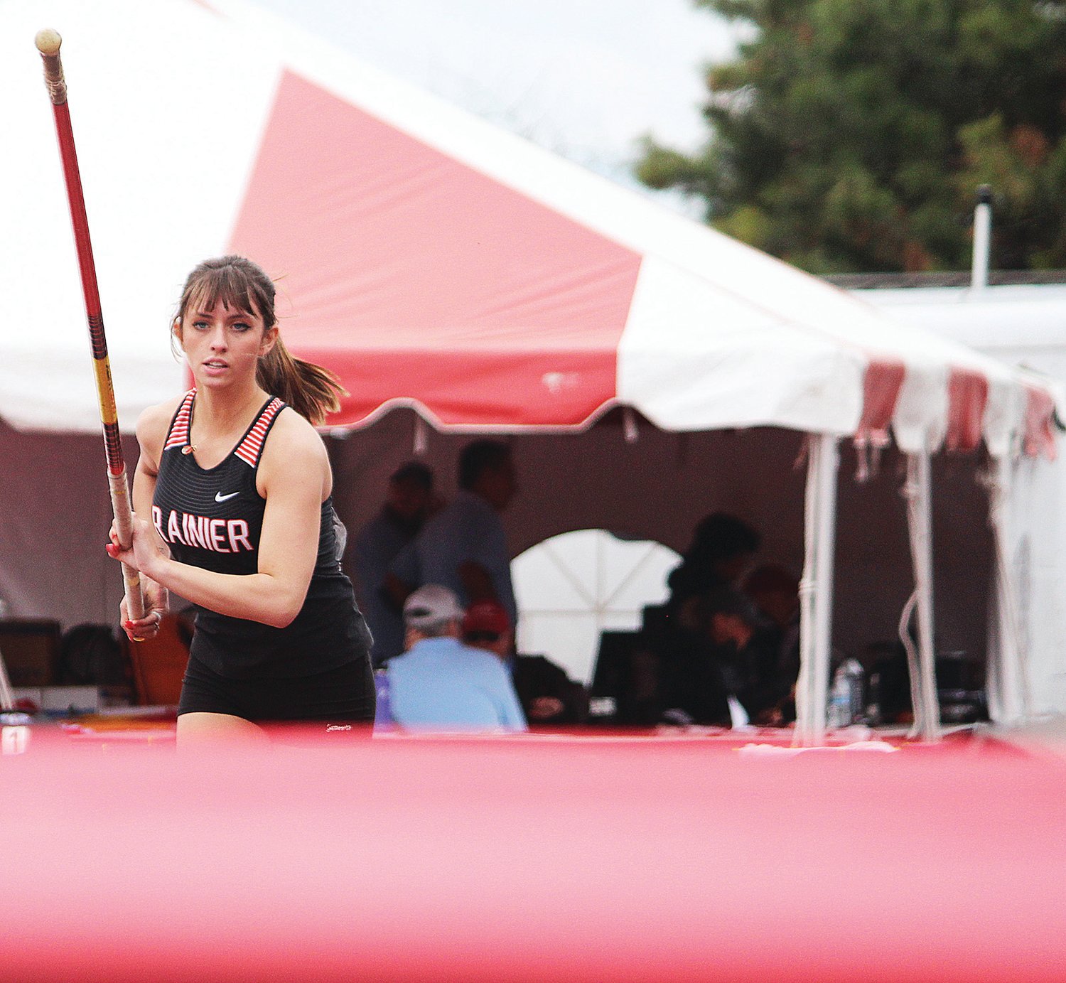 Rainier's Anna Champlin runs up to the pole vault bar during the State 1B/2B/1A Track and Field Championships in Cheney on Friday, May 27, 2022.