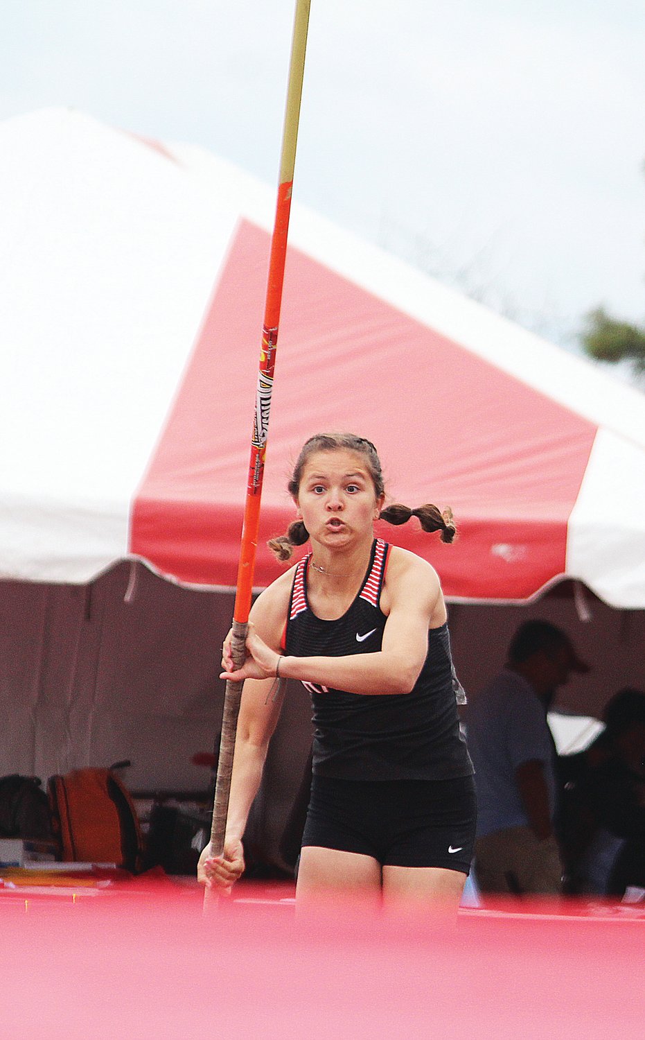 Rainier's Ella Marvin runs up to the pole vault bar during the State 1B/2B/1A Track and Field Championships in Cheney on Friday, May 27, 2022.