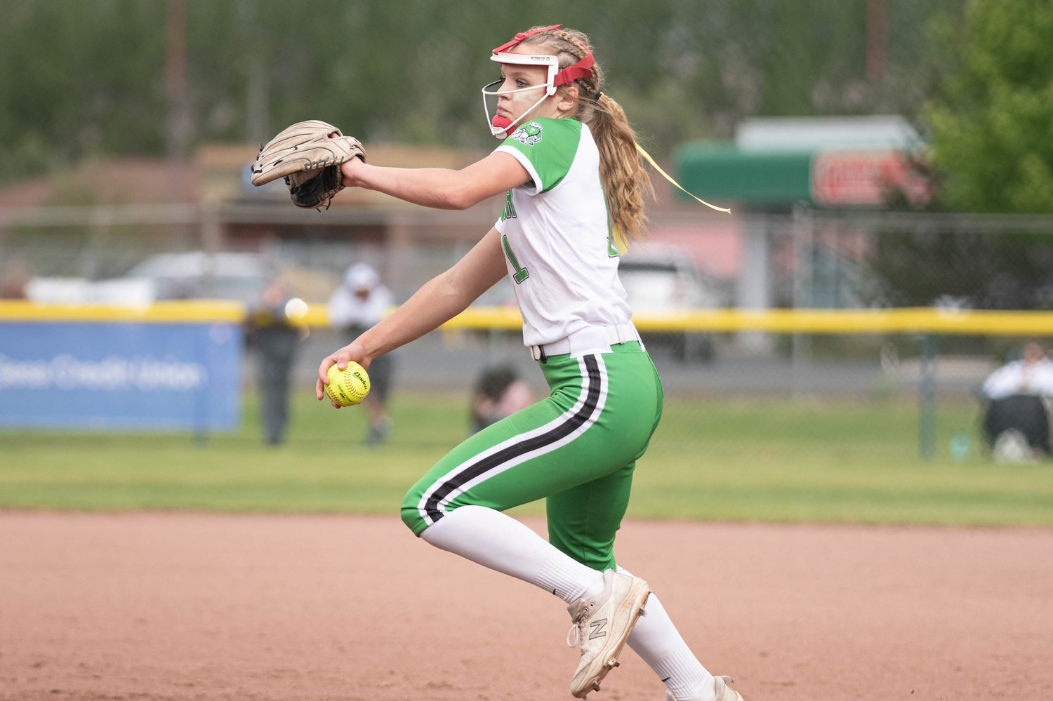 Tumwater pitcher Ella Ferguson winds up to deliver a pitch against Lynden in the 2A State Quarterfinals at Carlon Park in Selah May 27.