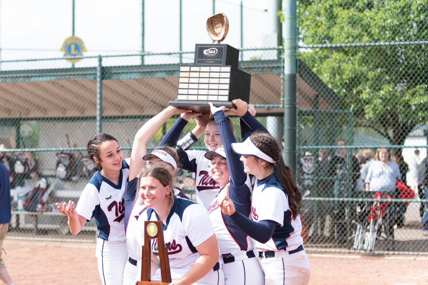 PWV's seniors hold up the state championship trophy after defeating Adna, 11-0 May 28 at the Gateway Sports Complex in Yakima.