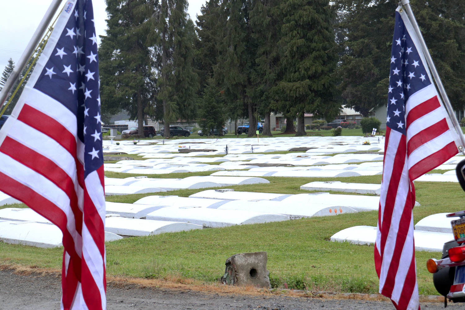 Flags mark veterans’ burial sites at Sticklin Greenwood Memorial Park during a rededication ceremony on Saturday. Volunteers place flags on 450 to 500 veteran gravesites every Memorial Day, though volunteers believe there are more gravesites whose graves do not reflect their veteran status.