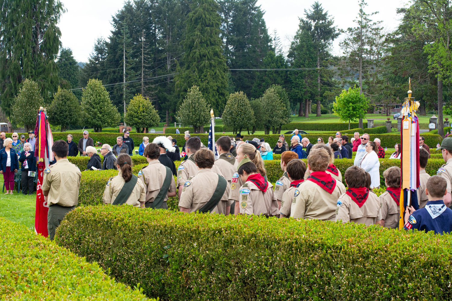 Boy Scout Troop 373 stands in columns during the Memorial Day ceremony at Claquato Cemetery on Monday morning.