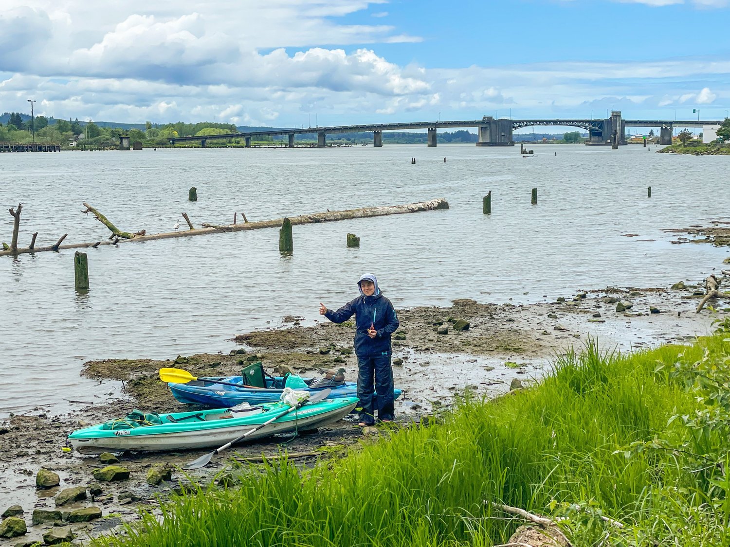Reporter Isabel Vander Stoep stops for a snack before a tough paddle against the tide under the Chehalis River Bridge in Aberdeen.