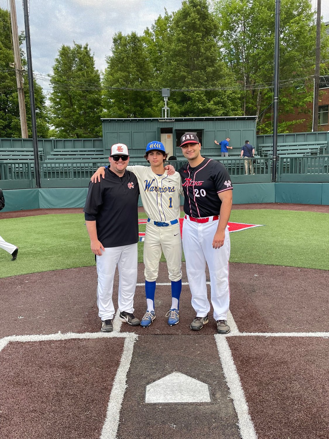 Rochester's Tony Groninger poses with his coaches, Kalama's Brandon Walker and R.A. Long's Ryan Littlefield, from the Southwest Washington Senior All-Star Game Wednesday.