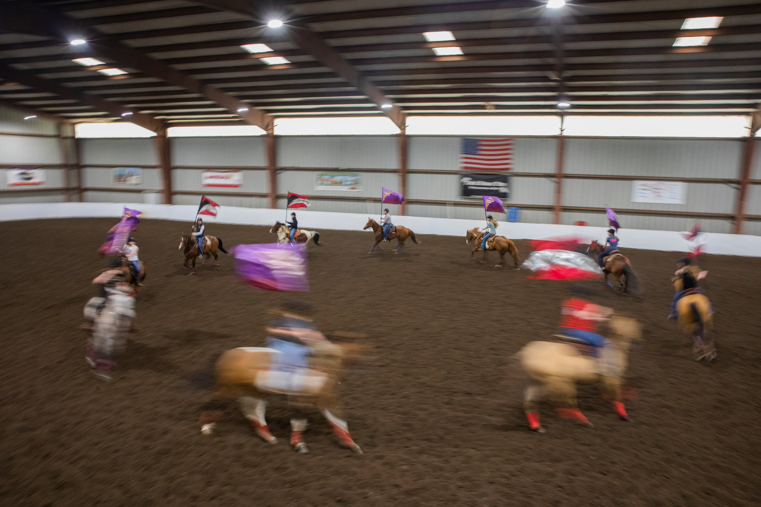 The W.F. West equestrian drill team runs through choreographed movements to music in Salkum’s Rocky Top Arena on Monday.