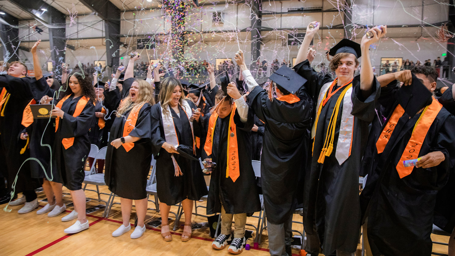 FILE PHOTO — Confetti and silly string flies through the air over graduates as they turn their tassels in Centralia in June 2022.