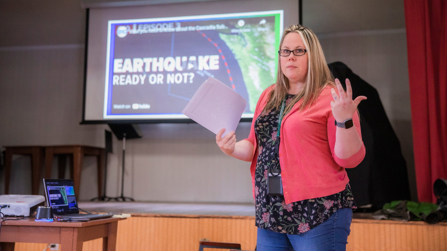 Erika Katt with the Lewis County Division of Emergency Management, speaks to a group at the Baw Faw Grange on Monday about the Cascadia Subduction Zone earthquake during one of several Lewis County earthquake preparedness meetings.