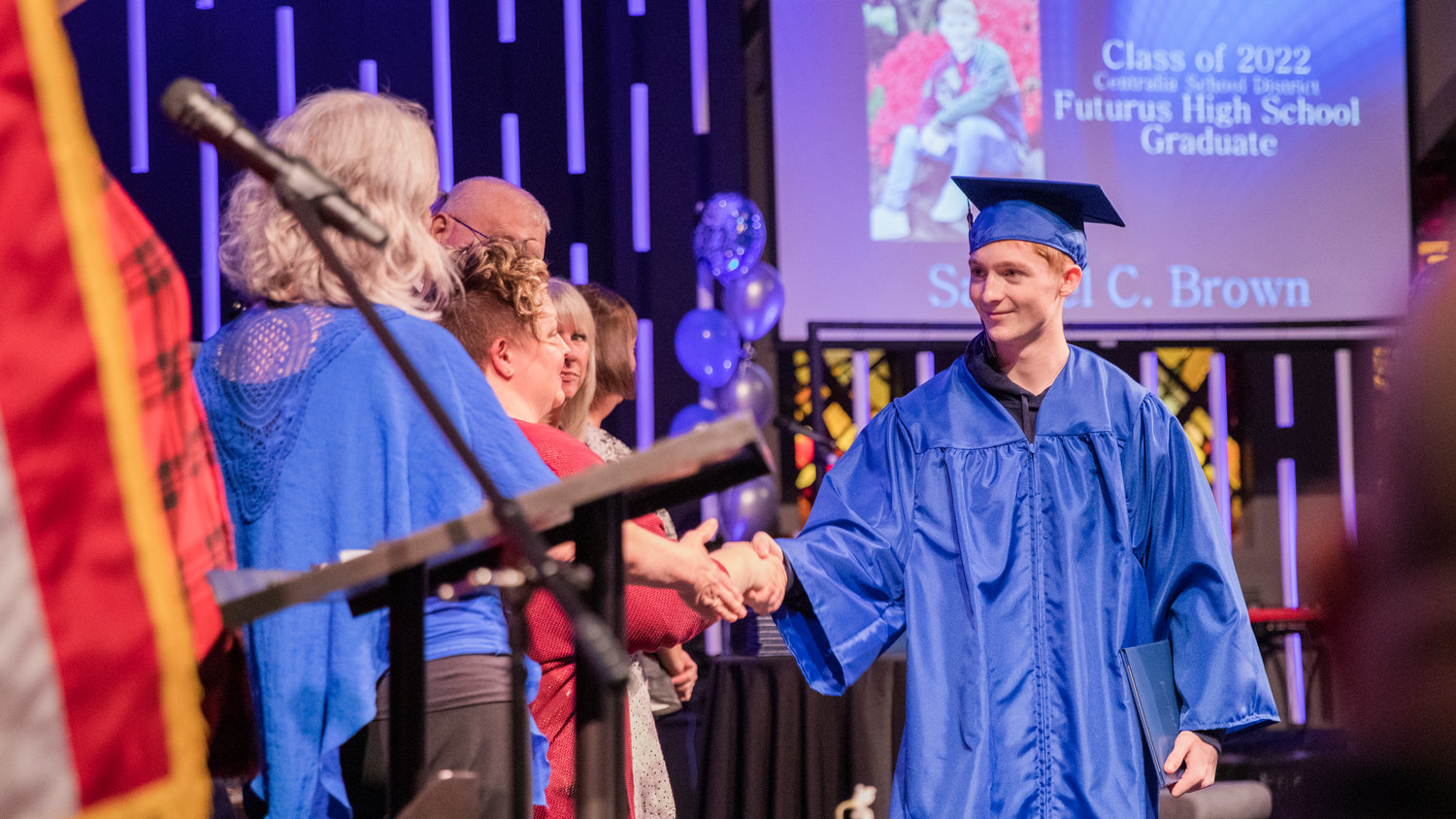 Samuel Brown smiles and shakes hands during a graduation ceremony for Futurus High School Tuesday in Centralia.