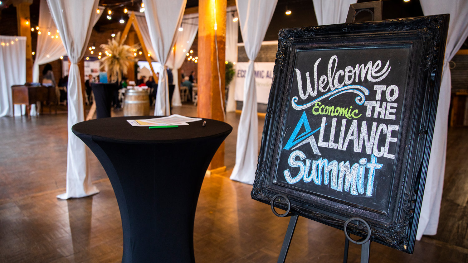 Signage sits on display inside The Loft for an Economic Alliance Summit event in Chehalis on Thursday.