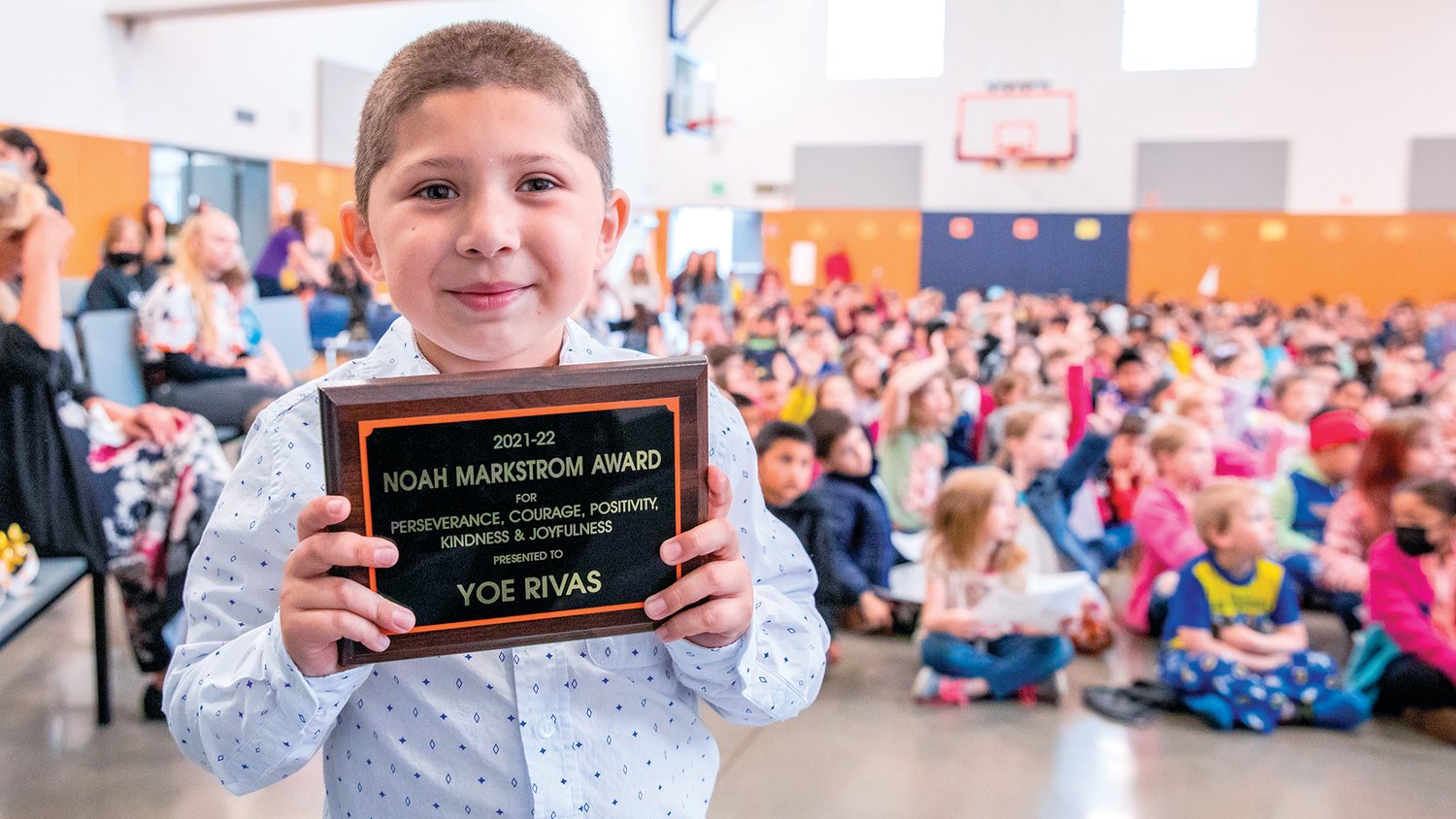 Yoe Rivas holds up a plaque after being named the Noah Markstrom Award recipient Friday at Fords Prairie Elementary in Centralia.