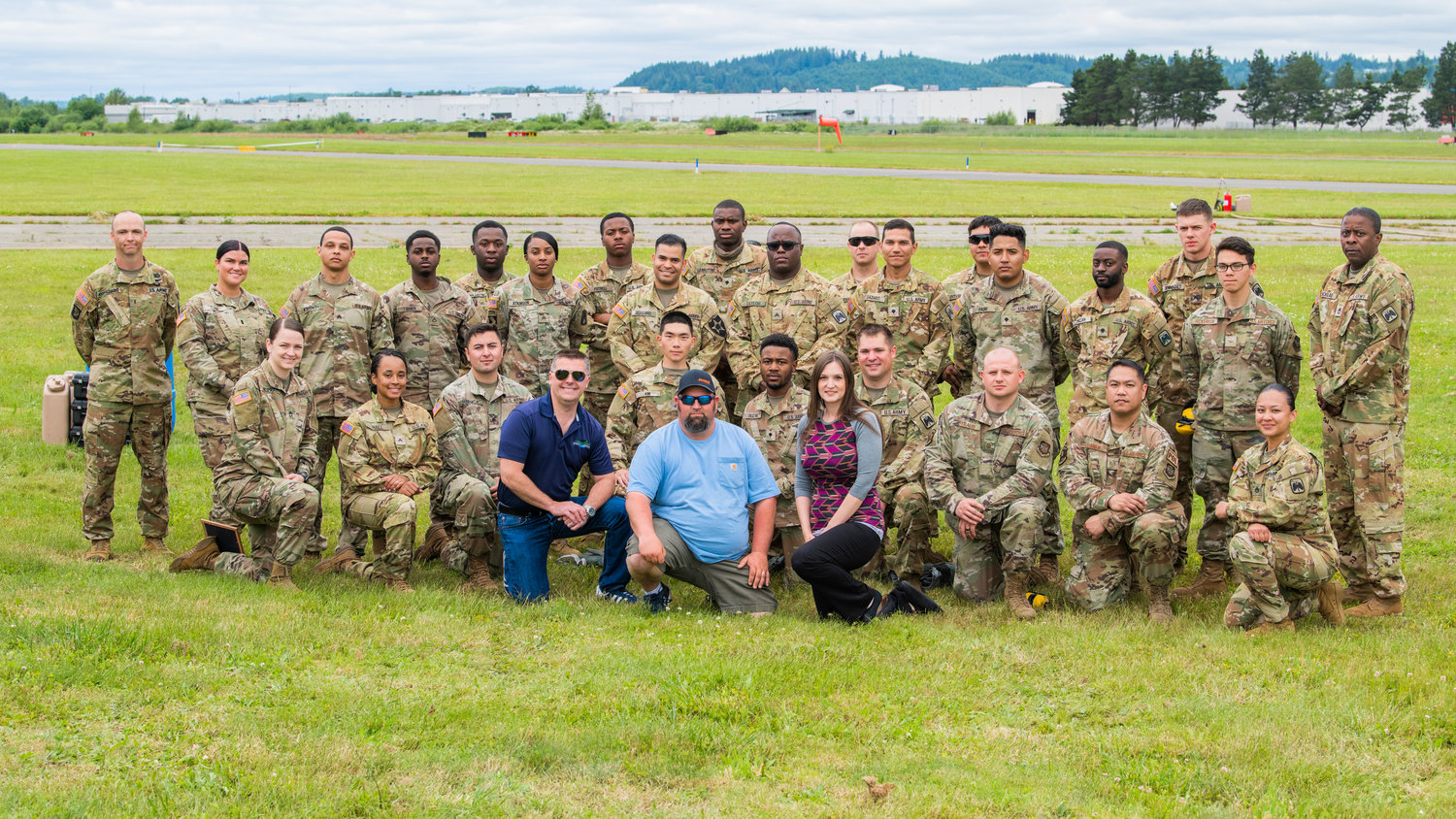 Staff from the Chehalis-Centralia Airport pose for a photo with members of the United States Army and Airforce from Joint Base Lewis-McChord during a military training exercise Wednesday in Chehalis.