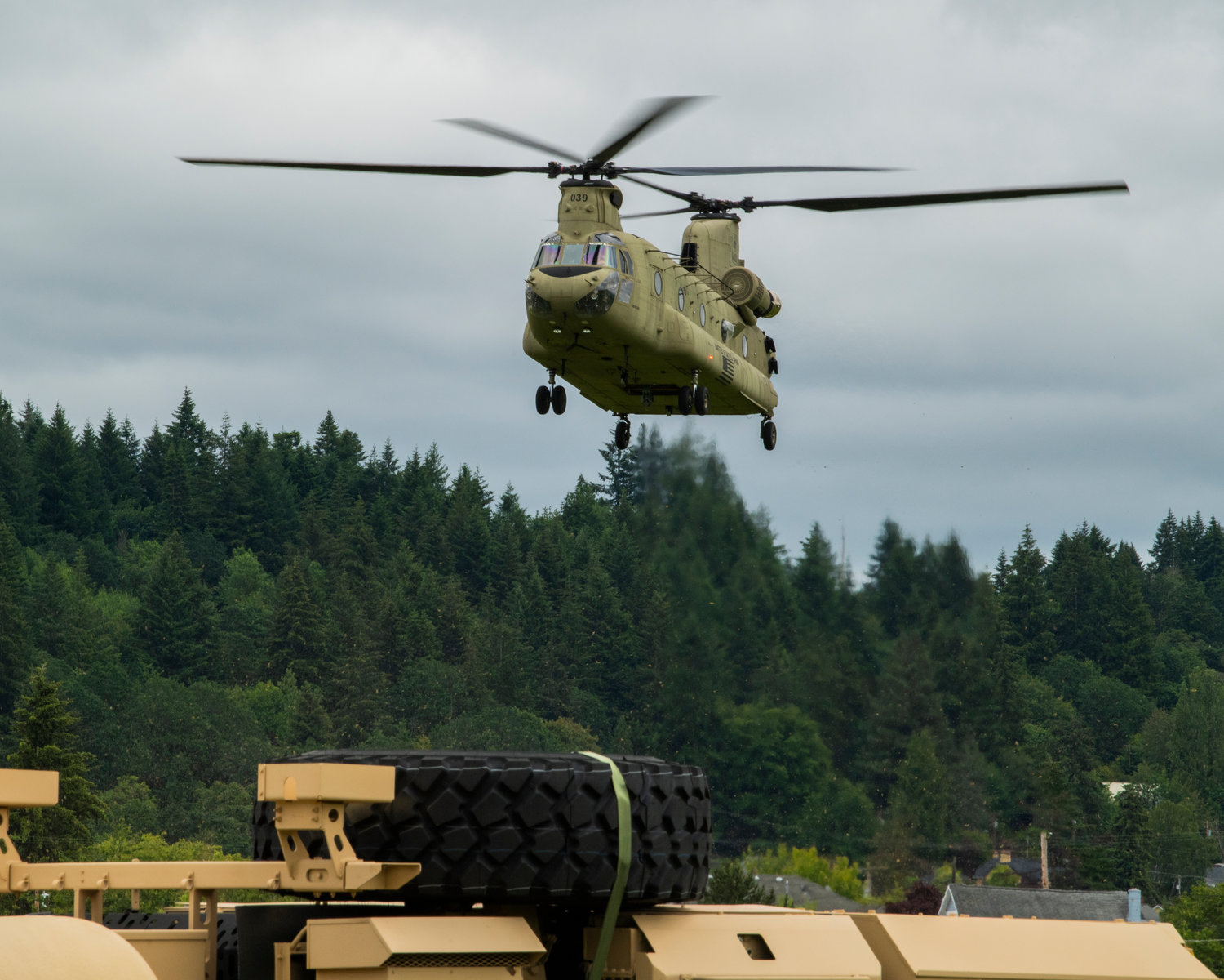 A Chinook helicopter prepares to land at the Chehalis-Centralia Airport during a military training exercise on Wednesday.
