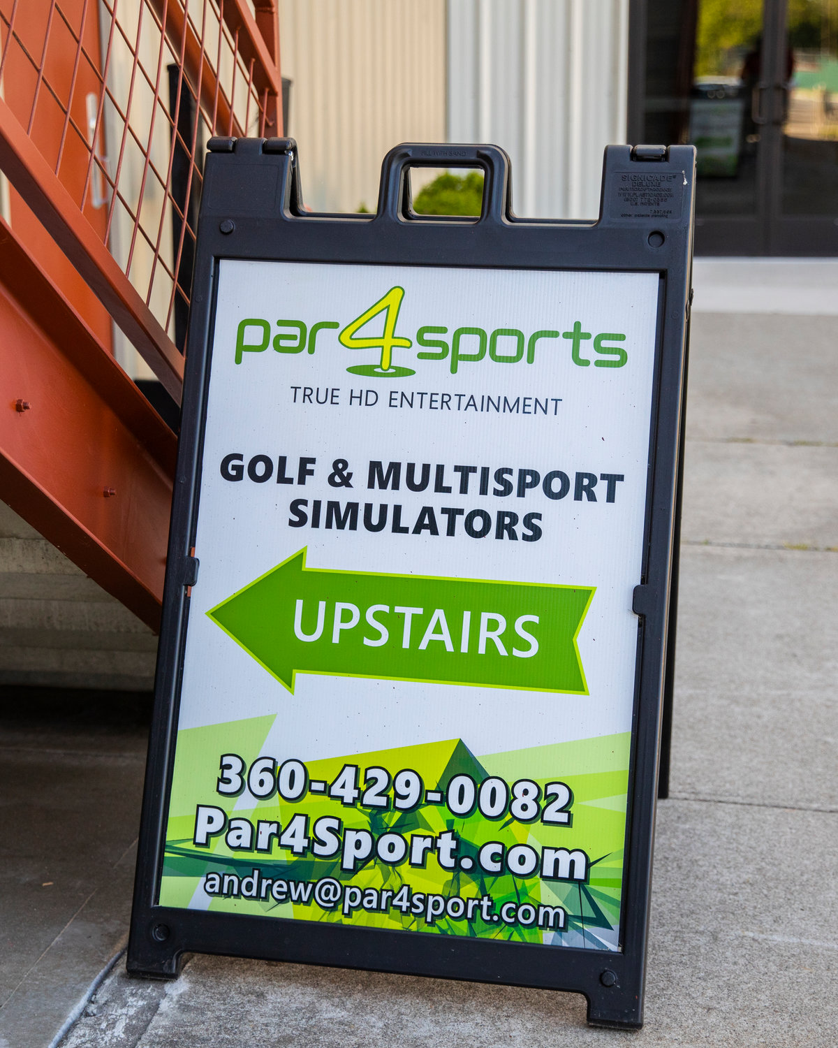 Signage for Par 4 Sports is displayed during a ribbon cutting ceremony in Centralia on Thursday outside the Northwest Sports Hub.