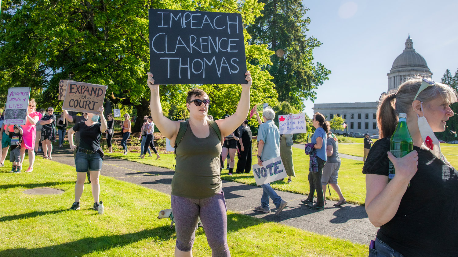 A sign rads "Impeach Clarence Thomas” during a protest in Olympia on Friday.