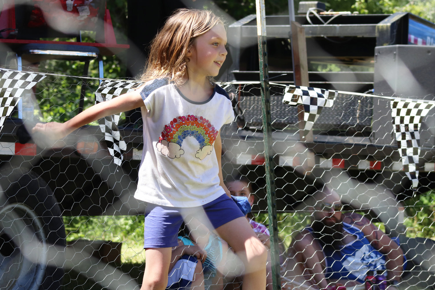 Athena, 6, prepares to launch a pair of socks at a chicken during Independence Valley Community Hall’s 42nd Annual Chicken Races in Rochester on Sunday.