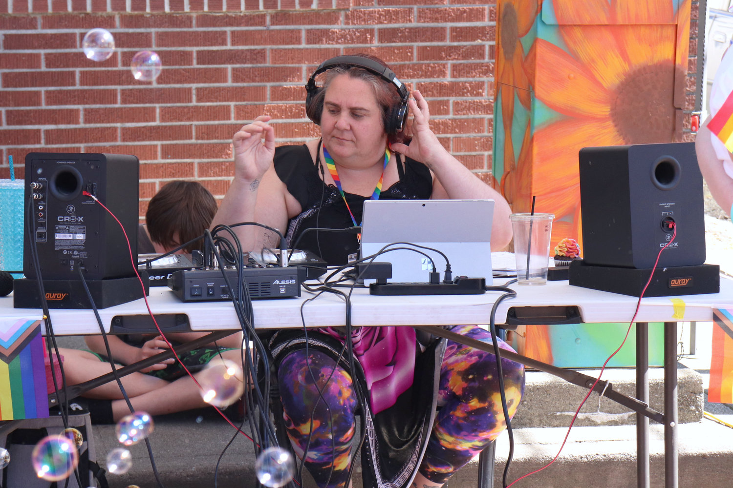 Renee Terralumina DJs during Lewis County Pride in Centralia on Saturday.