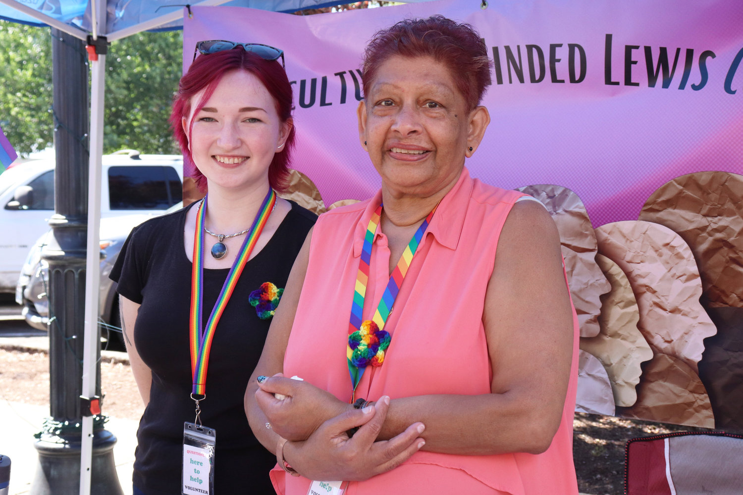 From left, Justine Pense and Usha Sahadeva-Brooks of Multicuturally Minded Lewis County pose for a photo during Lewis County Pride in Centralia on Saturday. Sahadeva-Brooks also represents Lewis County Seniors and the local chapter of the International Optimists Club.