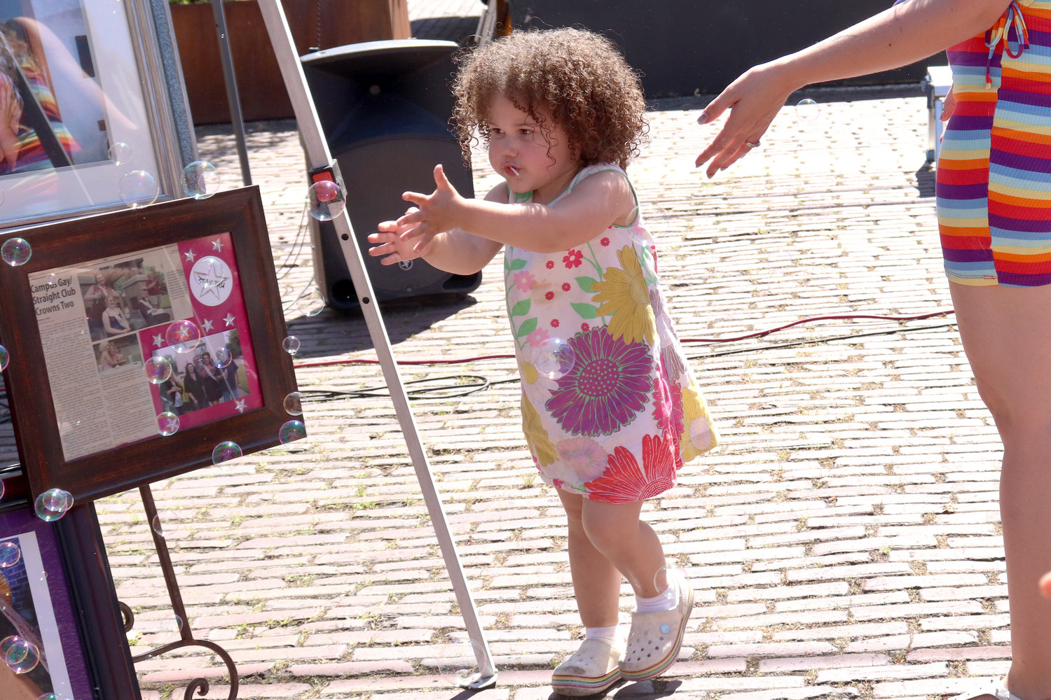 Layla, 1, chases bubbles during Lewis County Pride in Centralia on Saturday.