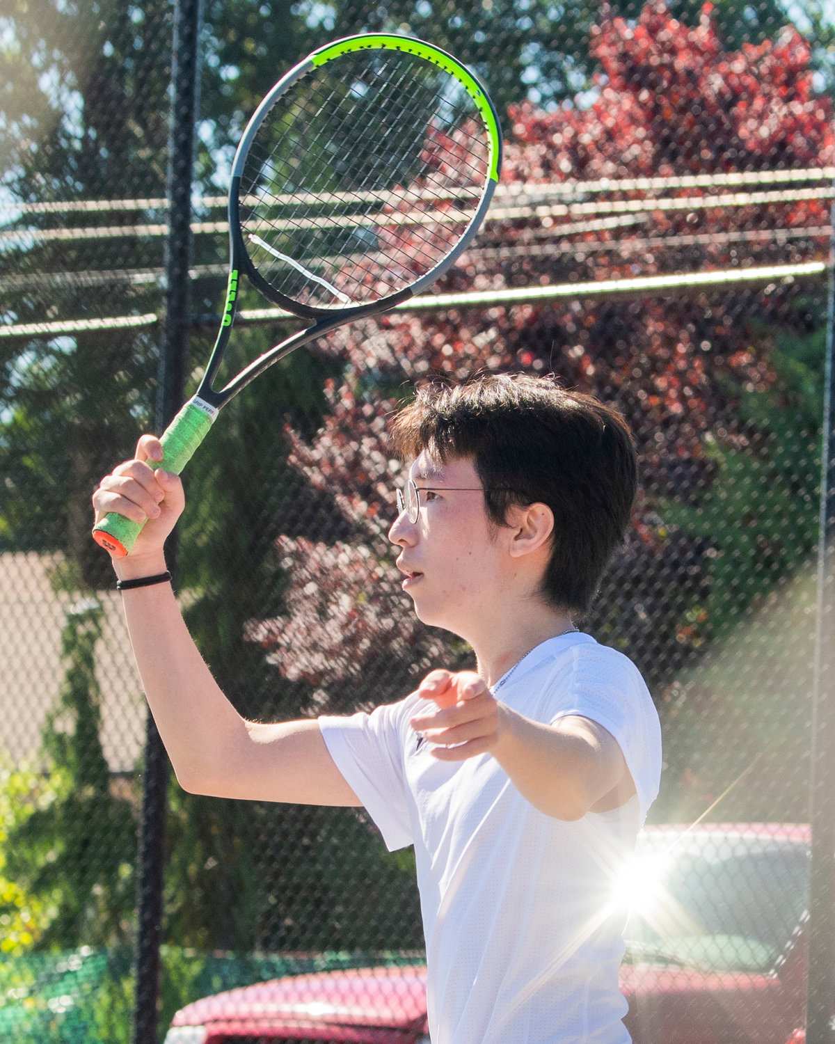 Andrew Pak, a W.F. West graduate, swings his racket during the Jack State Tennis Tournament at W.F. West High School on Saturday.