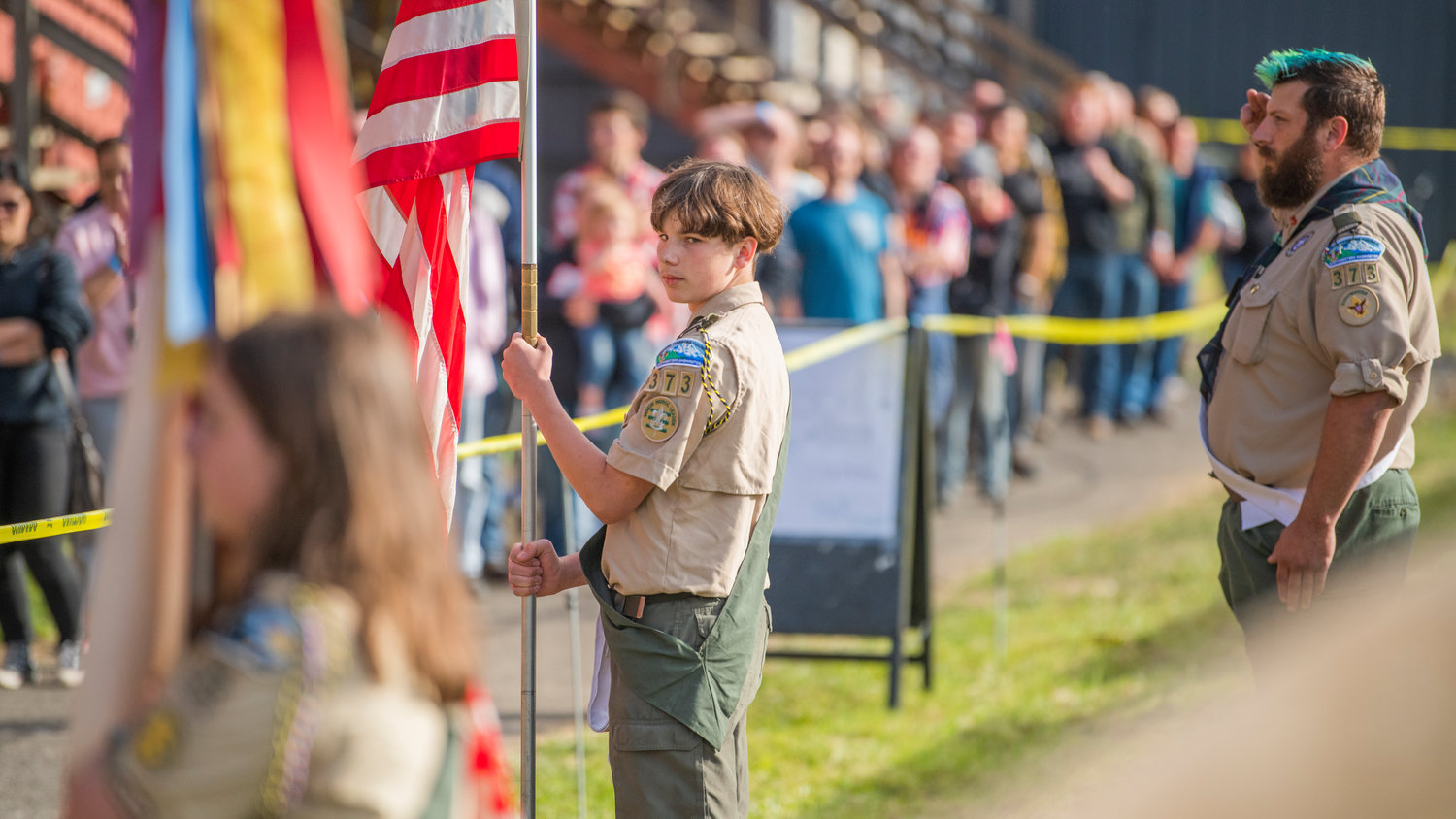 Scouts from Troop 373 in Chehalis present colors during Summerfest in Centralia at the Southwest Washington Fairgrounds Sunday evening.