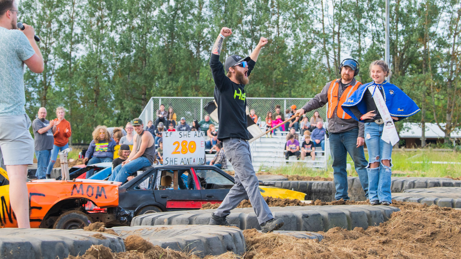 Brad Hunter, cheers as his vehicle wins “prettiest car,” during the Summerfest Demolition Derby at the Southwest Washington Fairgrounds Sunday in Centralia.