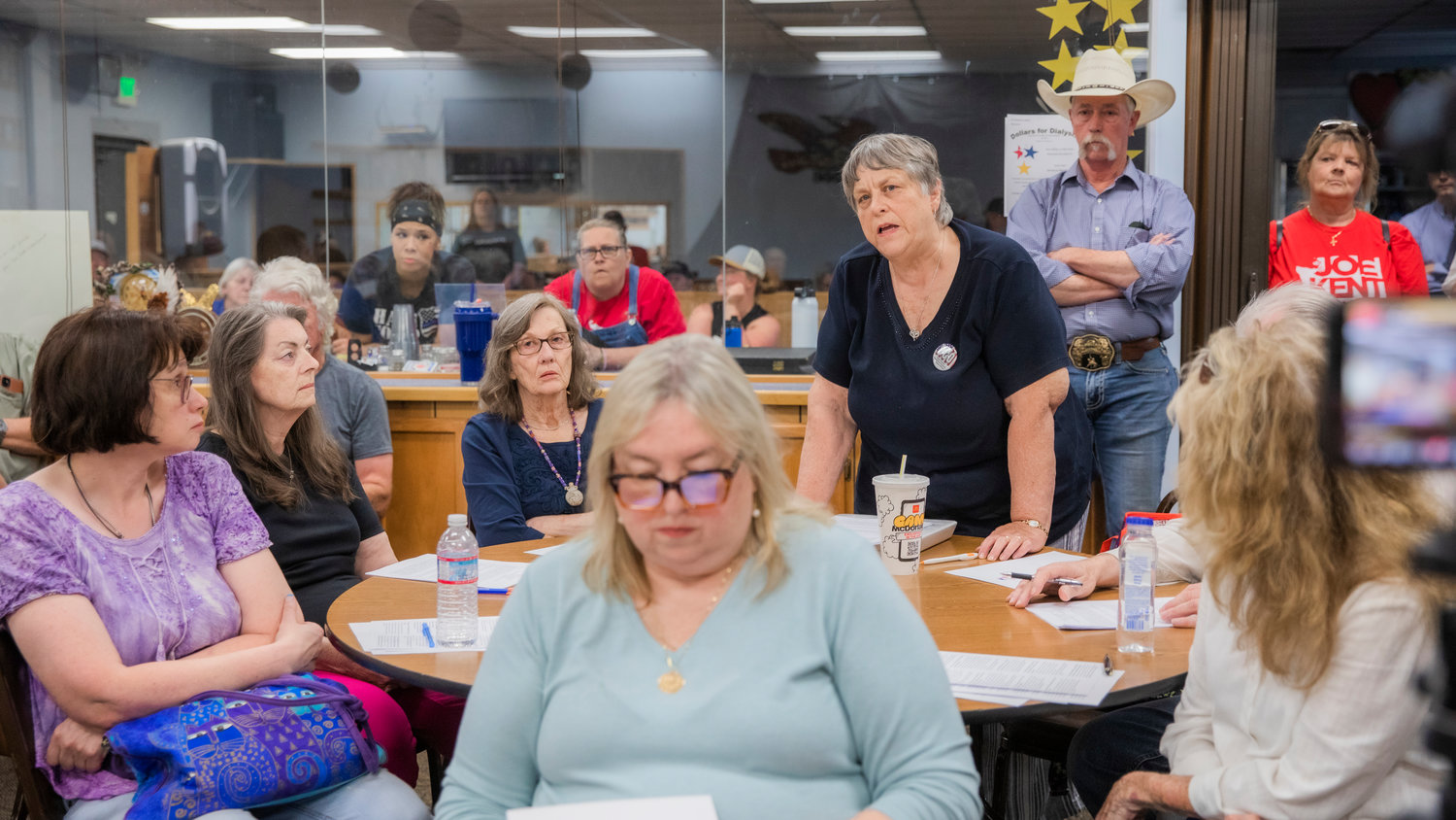 Carol Kearns, the Cowlitz Precinct Committee Officer, stands up to speak during a Lewis County Republicans meeting at the Chehalis Eagles Aerie Monday evening.