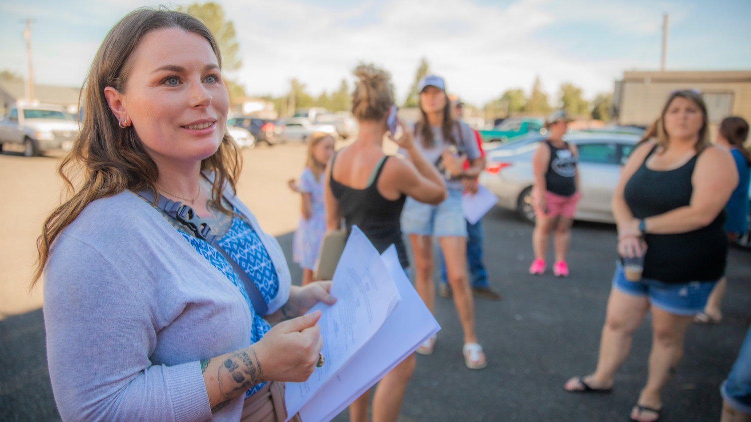 Erin Volz, Vice Chair of the Lewis County Republicans, talks to attendees waiting outside Chehalis Eagles Aerie Monday evening.