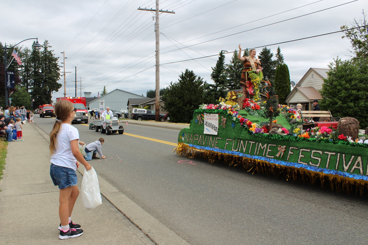 A young paradegoer watches as Princess Napawinah, Jennifer Keevy, 15, rides in the official Napavine Funtime Festival parade float in Saturday's 49th annual Napavine Funtime Festival parade.