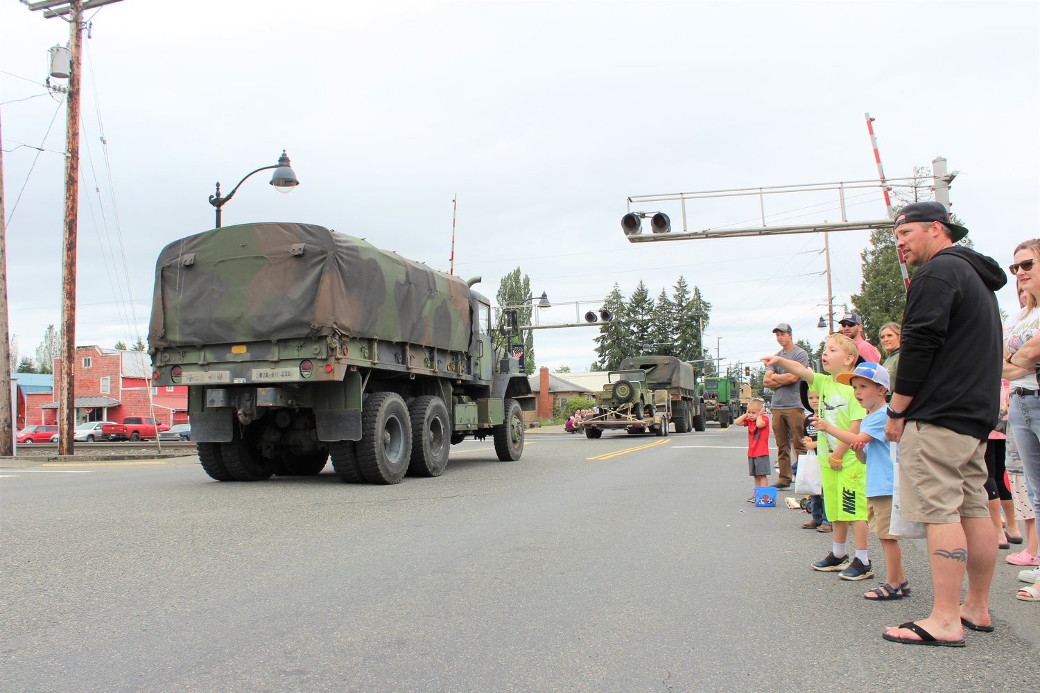 Cohen Williams, 4, and Calloway Potter, 5, react with wonder at military vehicles in the Napavine Funtime Festival parade.